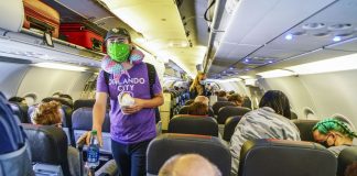 Woman duct taped on flight after she tried to open the door on American Airlines Plane (video)