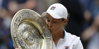FILE - Australia's Ashleigh Barty poses with the trophy for the media after winning the women's singles final after defeating the Czech Republic's Karolina Pliskova on day twelve of the Wimbledon Tennis Championships in London, Saturday, July 10, 2021. Wimbledon champion Ash Barty finished No. 1 in the WTA singles rankings for the third consecutive season, while Katerina Siniakova topped the doubles rankings for the second time. Barty, a 25-year-old from Australia, joins Serena Williams, Steffi Graf, Martina Navratilova and Chris Evert as the only women to lead the year-end tennis rankings three straight times. (Pete Nichols/Pool via AP, File)