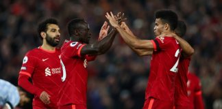 Salah scores twice to lead the Reds to the top of the table