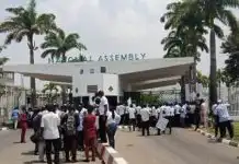 NASS workers block NASS gate as they protest unpaid allowances and arrears