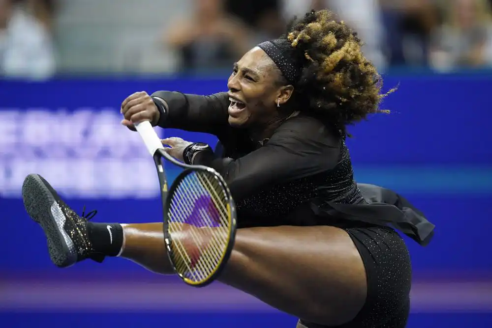 Serena Williams, of the United States, follows through on a shot to Ajla Tomljanovic, of Austrailia, during the third round of the U.S. Open tennis championships, Friday, Sept. 2, 2022, in New York. (AP Photo/Charles Krupa)