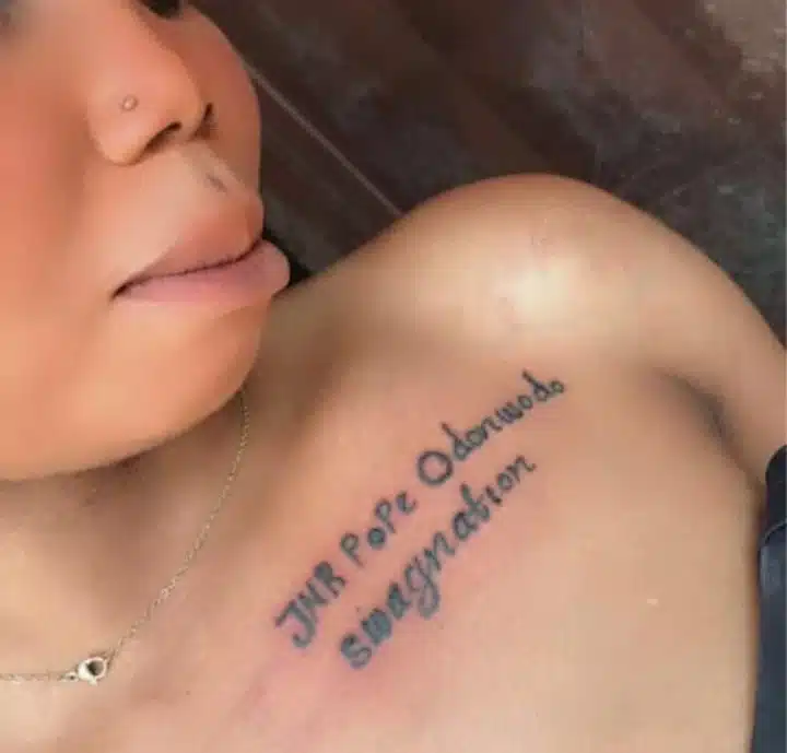 Junior Pope reacts as female fan tattoos his full name on her chest