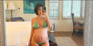 Kourtney Kardashian shows off her baby bump (photos/video)