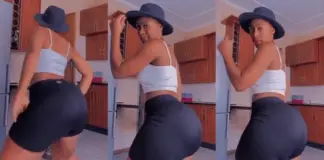 Ebony chocolate skin lady Dances so lovely in her kitchen with hat on her head – Video