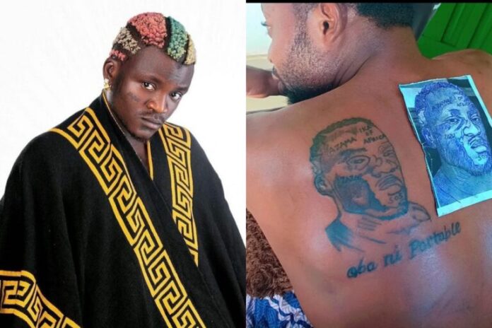 Portable credits fan for tattooing his face on his body