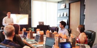 A team in an office discussing request for proposal during a meeting