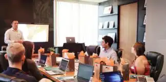 A team in an office discussing request for proposal during a meeting