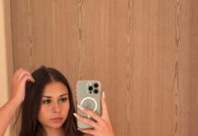 a woman in a garment taking a selfieOnlyFans Star Sophie Rain Buys $2.7M Mansion After Earning $72M Online