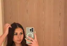a woman in a garment taking a selfieOnlyFans Star Sophie Rain Buys $2.7M Mansion After Earning $72M Online
