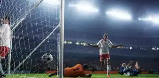 Football player celebrating decisive late Premier League goal 